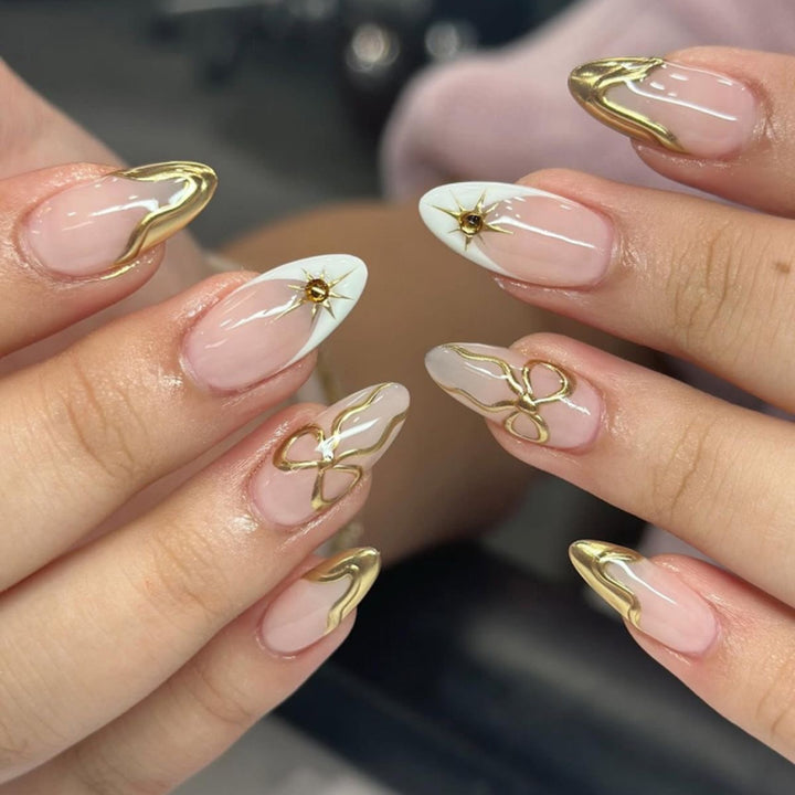 Artistic stiletto nails with elegant gold accents Bowlift