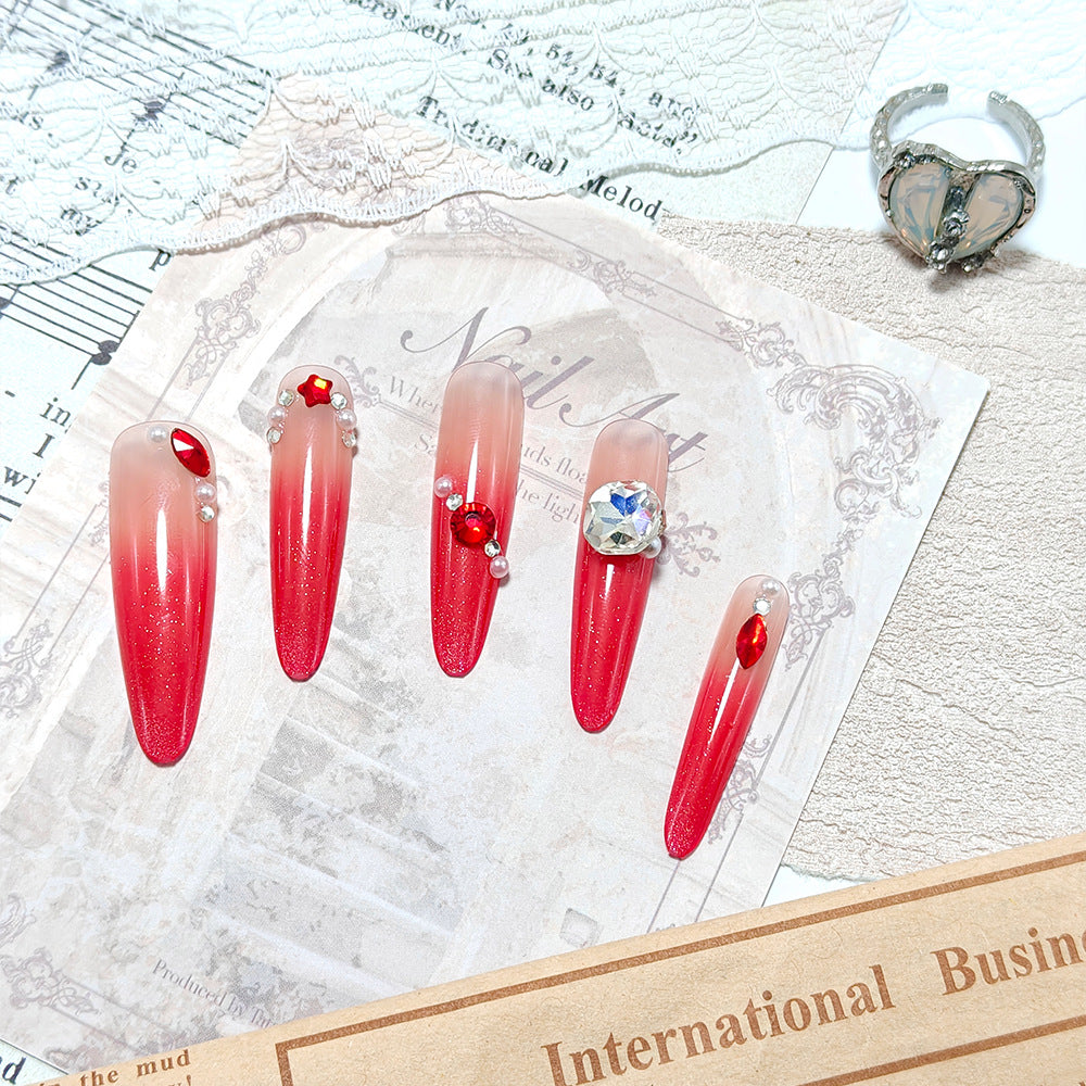 Artificial nails in elegant ombre style with glitter and jewelry accents Bowlift