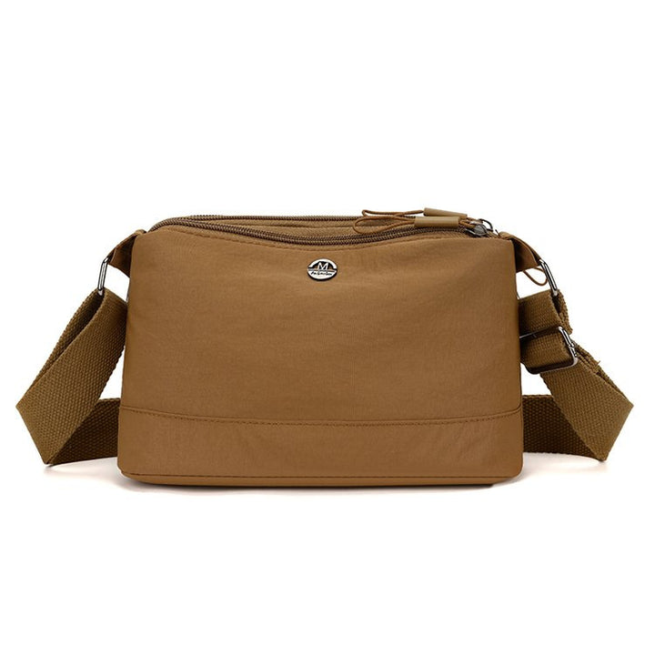 Shoulder bag with adjustable carrying strap and intelligent compartment system Bowlift