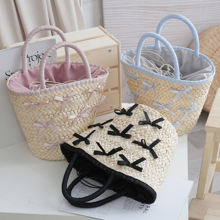 Basket bag with delicate bows and padded edge Bowlift