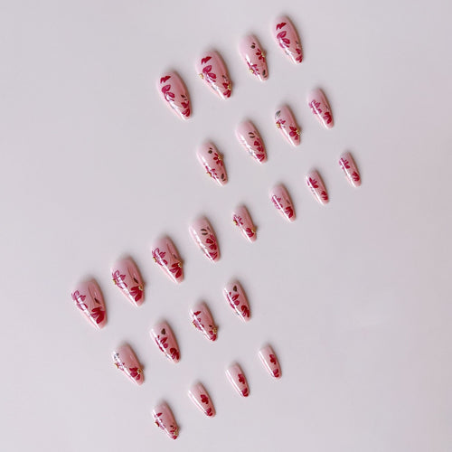 Artificial nail set with floral patterns and golden accents Bowlift