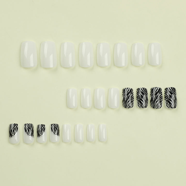 Artful nail extensions with stylish zebra pattern Bowlift