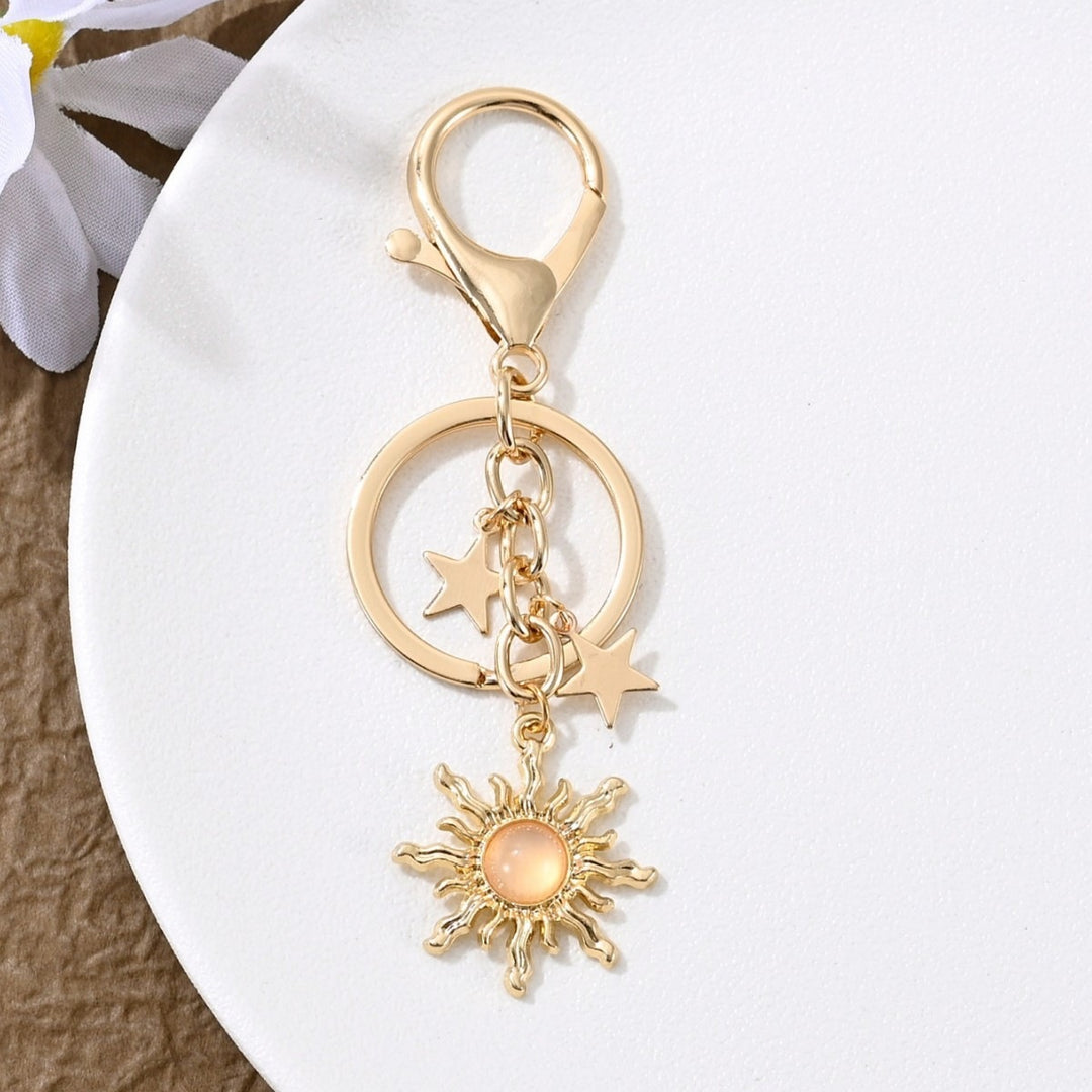Keychain with Sparkling Sun Motif Bowlift