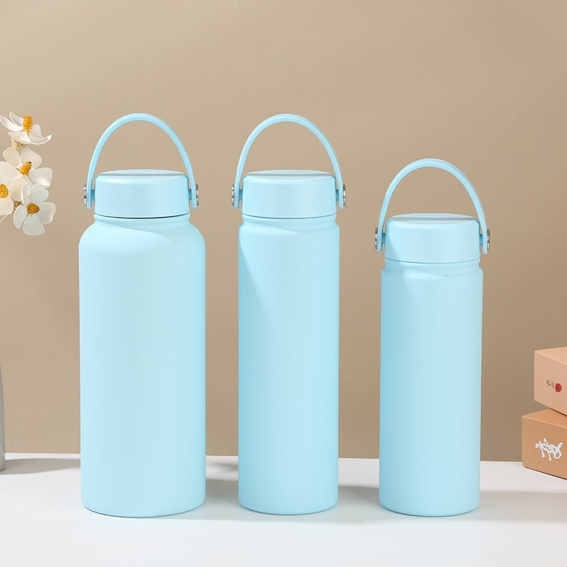 Women's double-walled insulated water bottle with practical carrying handle Bowlift