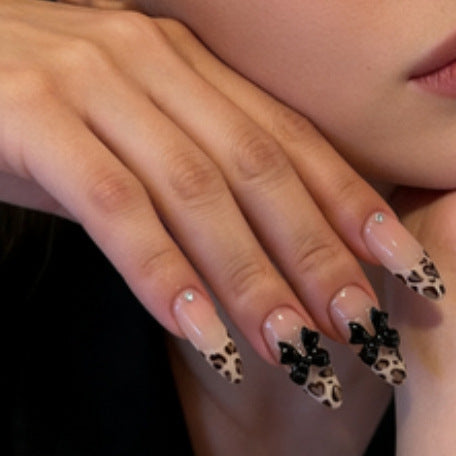 Creative artificial nails with stylish leopard pattern and bow accents Bowlift