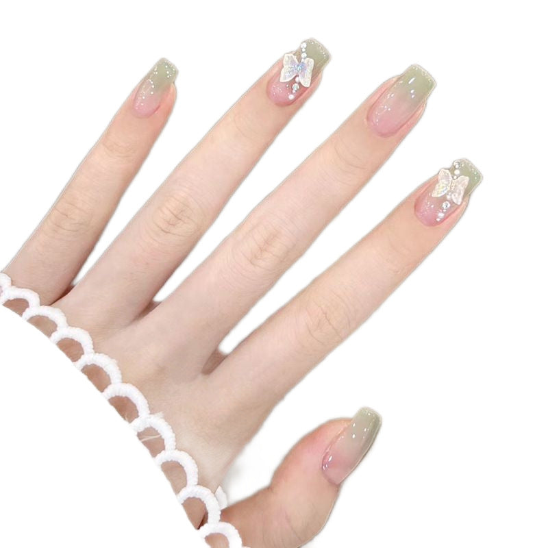 Artificial artificial nails with elegant ombre design and jewelry accents Bowlift