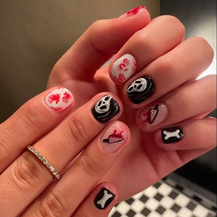 Creative Halloween Nail Art Set with Creepy Designs and Sparkling Accents Bowlift