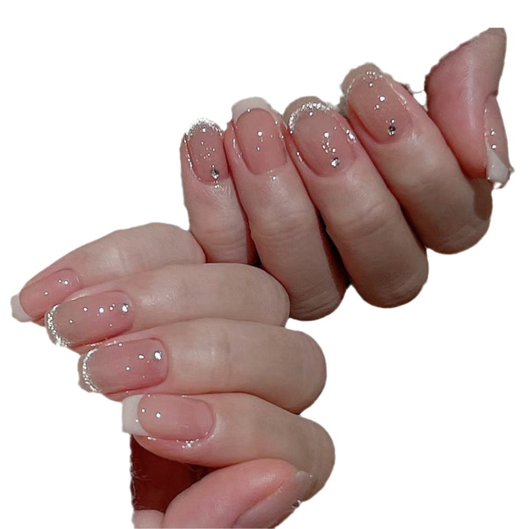 Glamorous artificial nails with filigree rhinestone details Bowlift