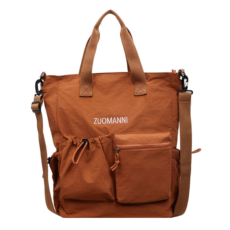 Tote bag with multifunctional outer pockets and adjustable shoulder strap Bowlift
