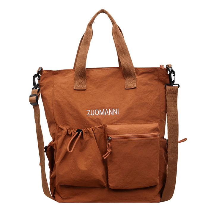 Tote bag with multifunctional outer pockets and adjustable shoulder strap Bowlift