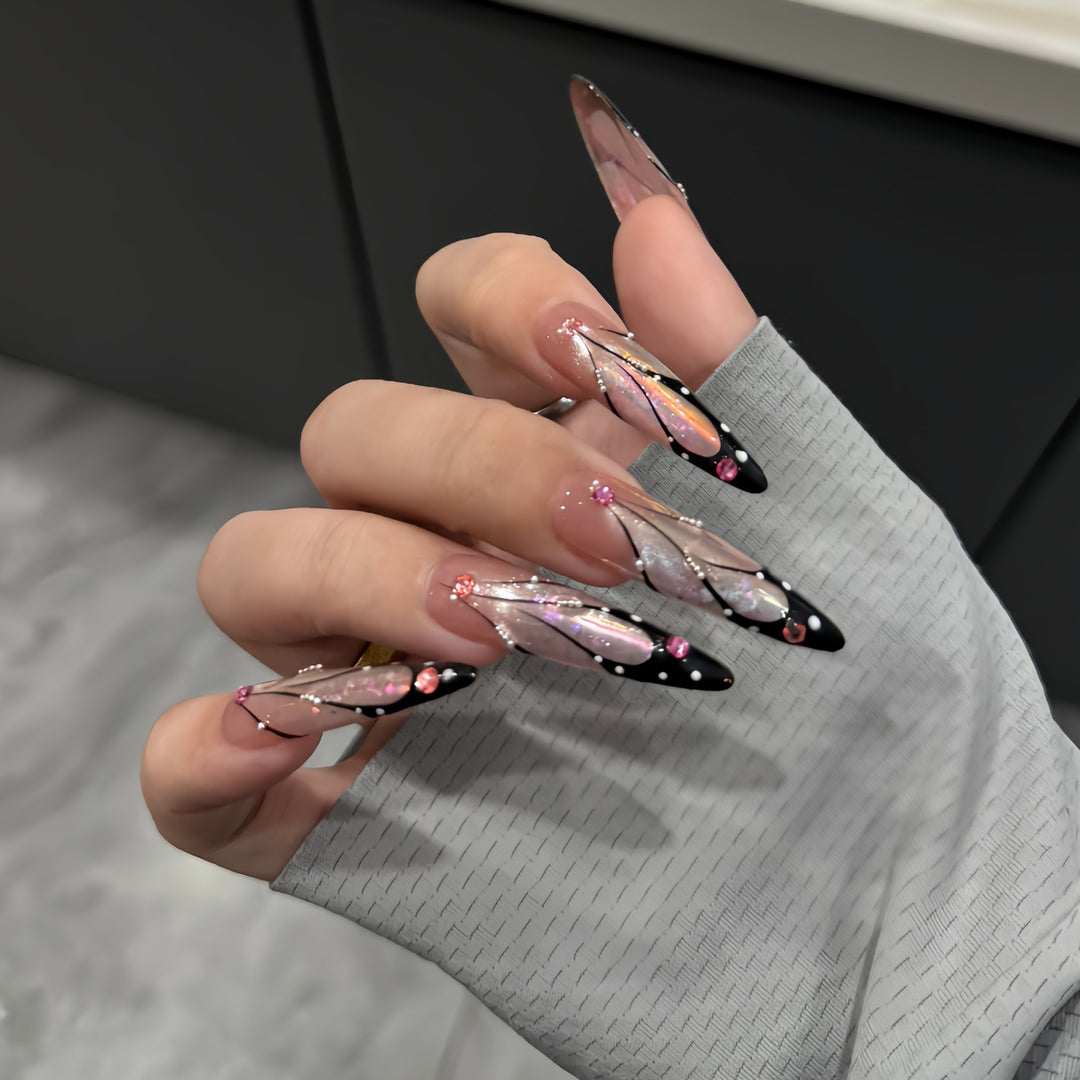 Artifical nail tips with elegant designs and glitter accents Bowlift