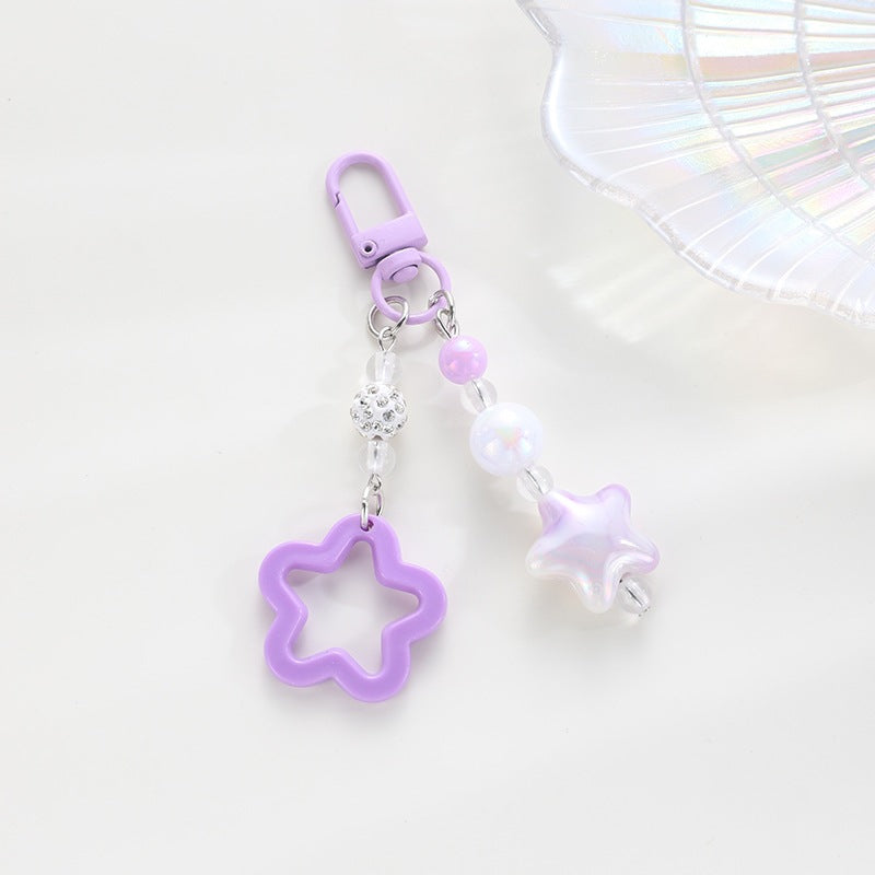 Playful keychain with floral and star motif Bowlift