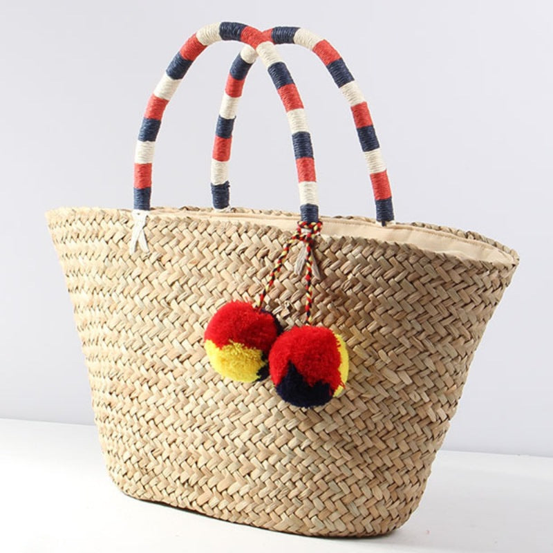 Braided beach bag with decorative pompons Bowlift