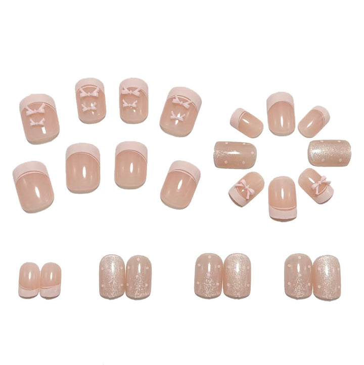 Artificial nails with delicate bow and glitter motifs Bowlift