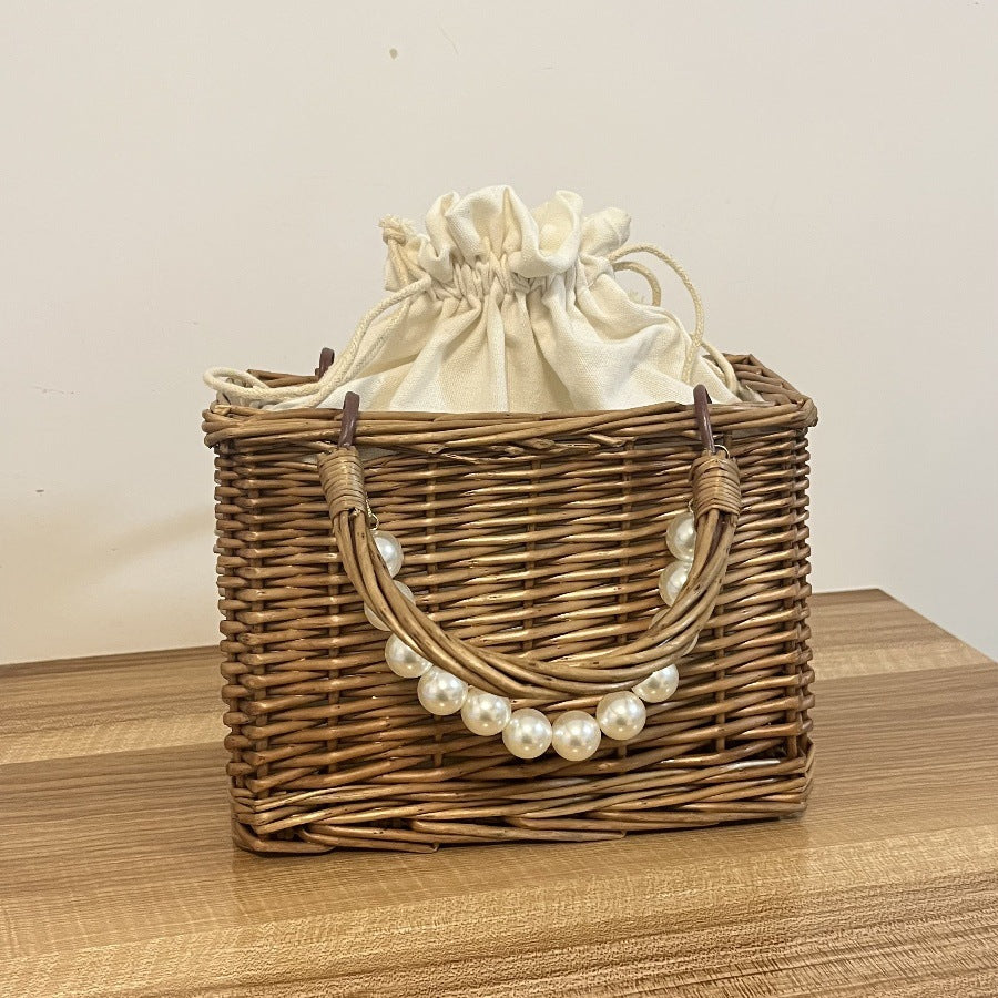 Ladies' basket bag with decorative pearl accents and bow decoration Bowlift