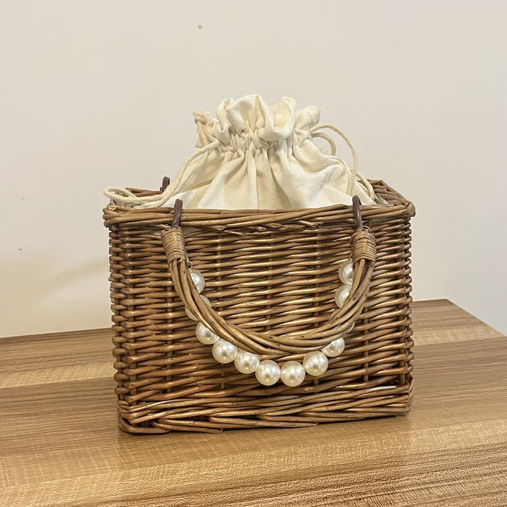 Ladies' basket bag with decorative pearl accents and bow decoration Bowlift