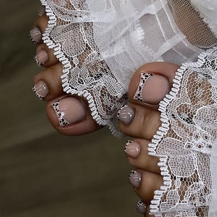Artistic toenail design with elegant tips Bowlift
