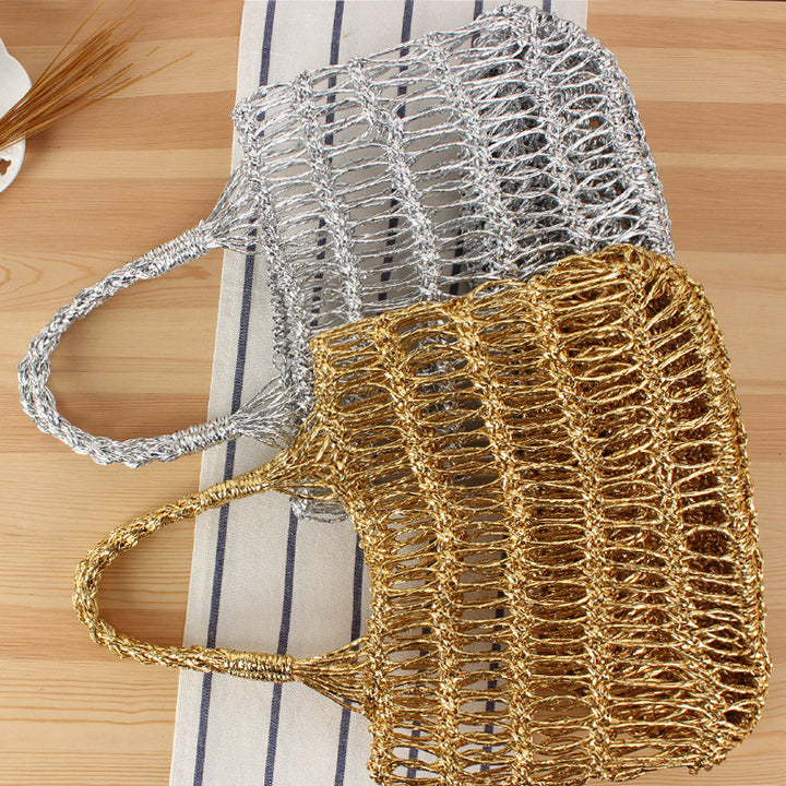 Shoulder bag made of punched metal grid Bowlift