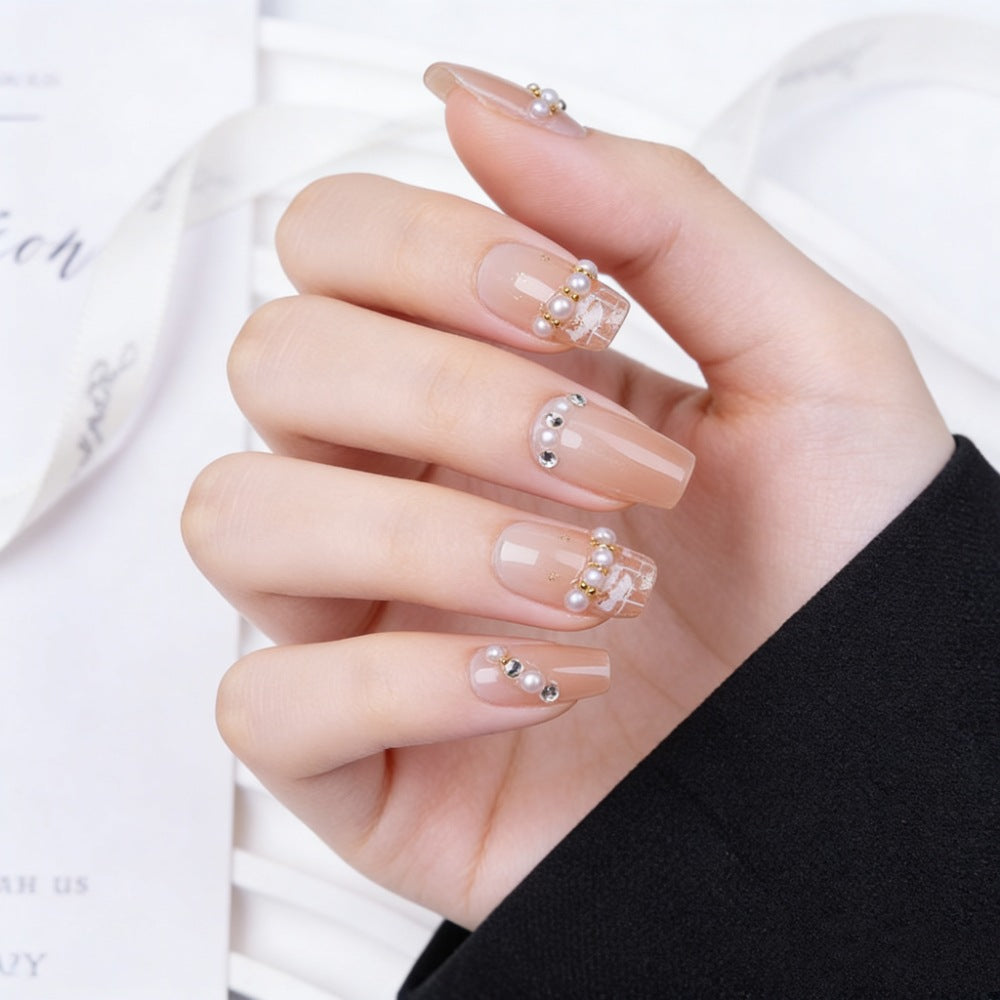 Artificial nails with elegant pearl and glitter decorations Bowlift