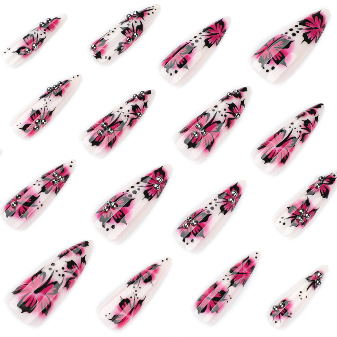 Artful nail art with floral design and rhinestone accents Bowlift
