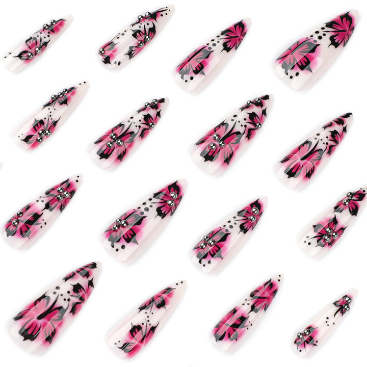 Artful nail art with floral design and rhinestone accents Bowlift