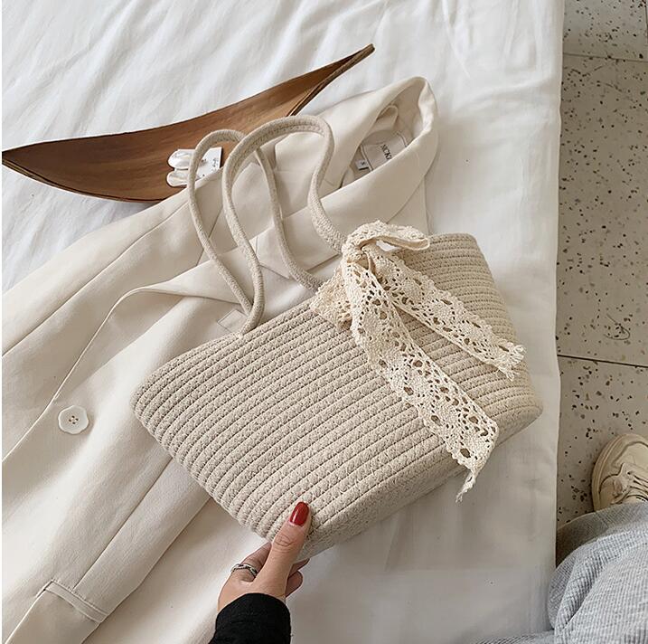 Handcrafted straw bag with lace accent Bowlift