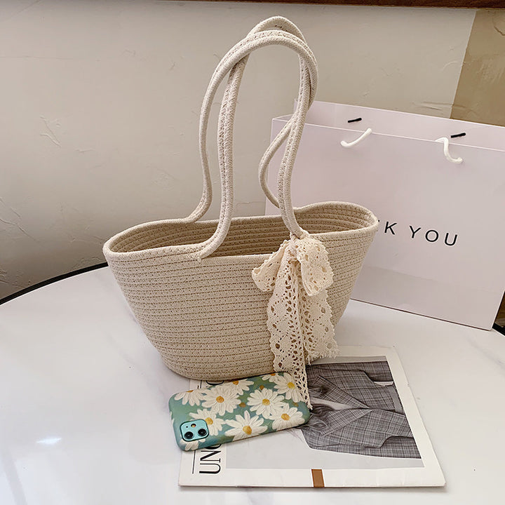 Elegant Bast Handbag with Lace Accent Bowlift