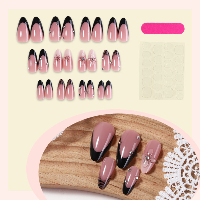 Acrylic nail set with elegant glitter and flower accents Bowlift