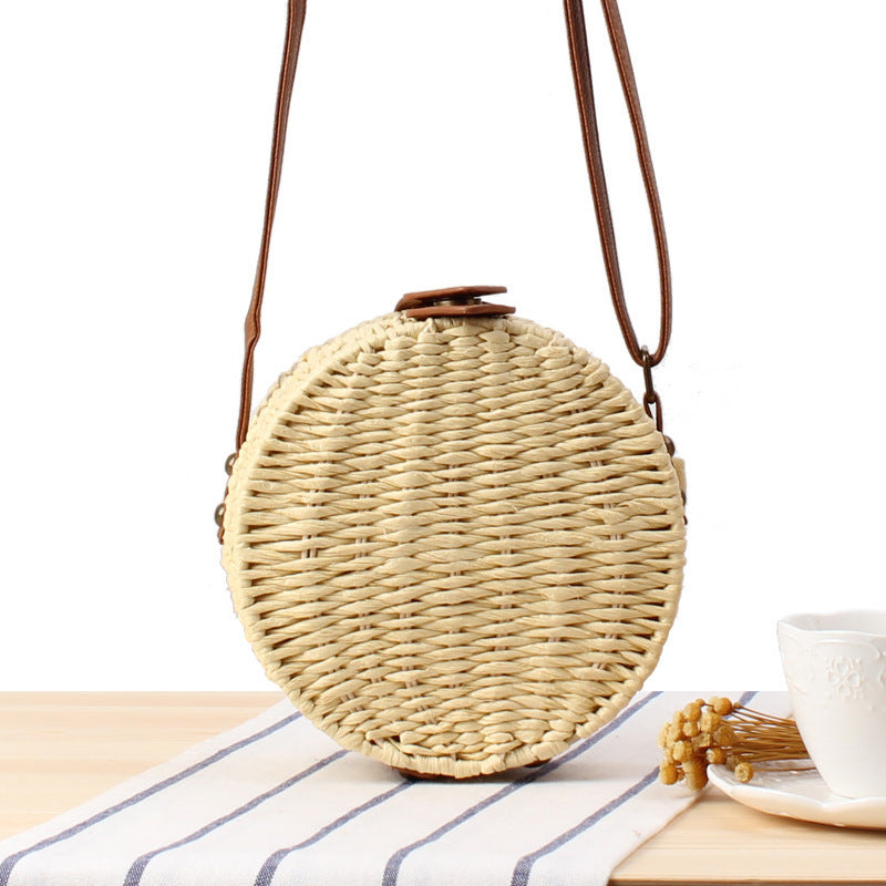 Round basket bag with leather accents Bowlift