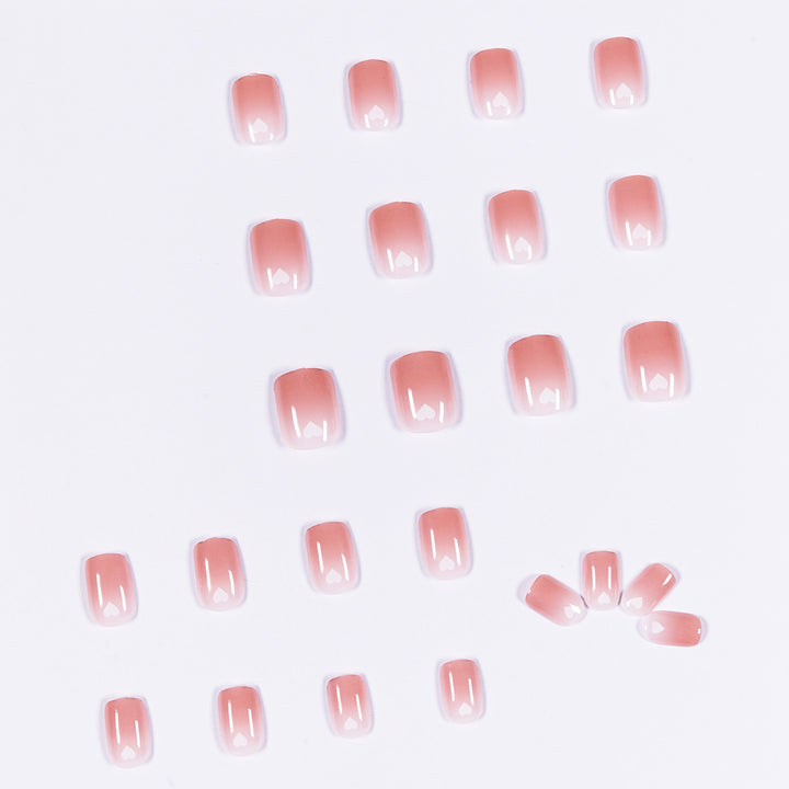 Artful nail art with heart-shaped accents and gentle ombre effect Bowlift