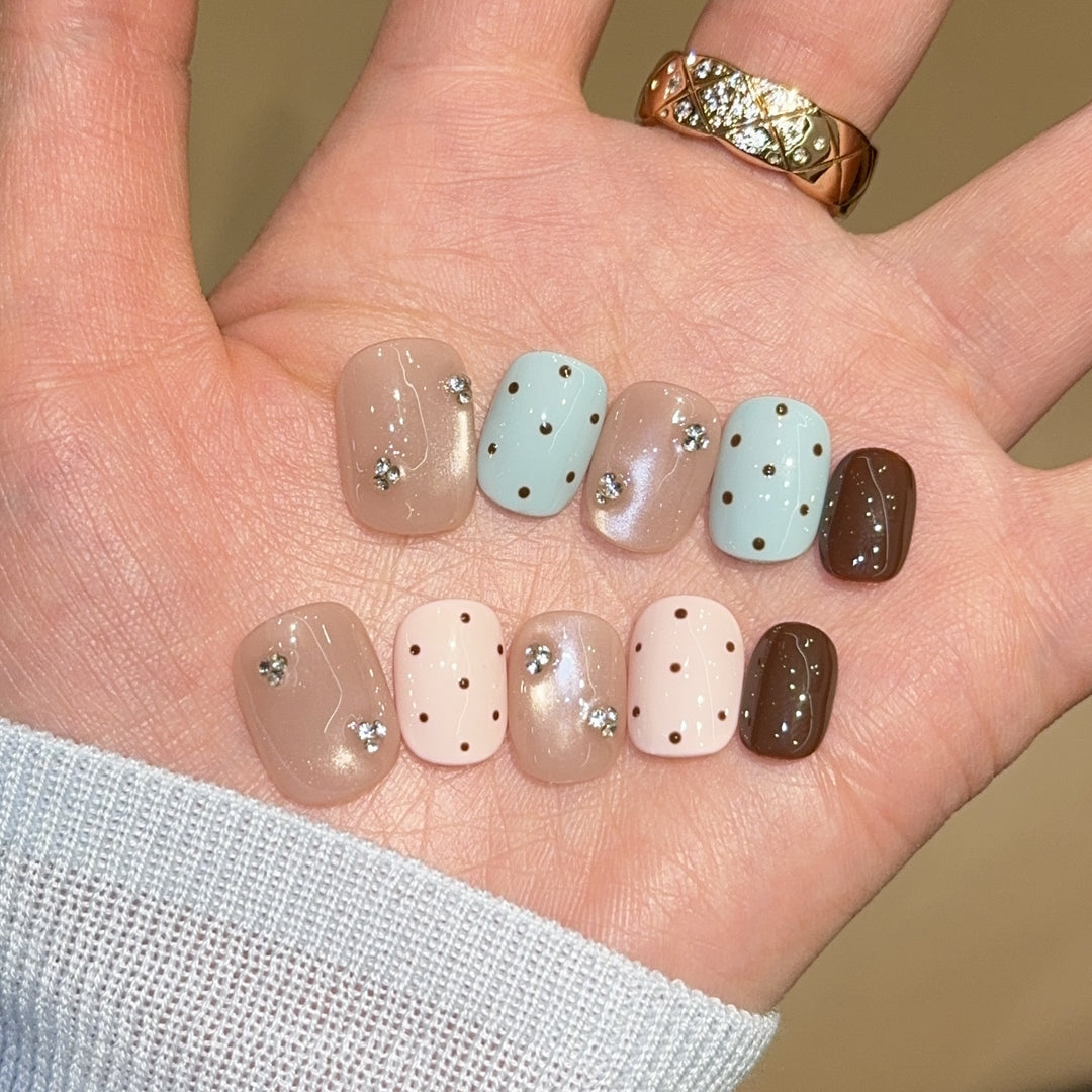 Acrylic nails with rhinestones and glitter Bowlift
