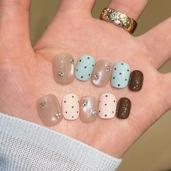 Acrylic nails with rhinestones and glitter Bowlift