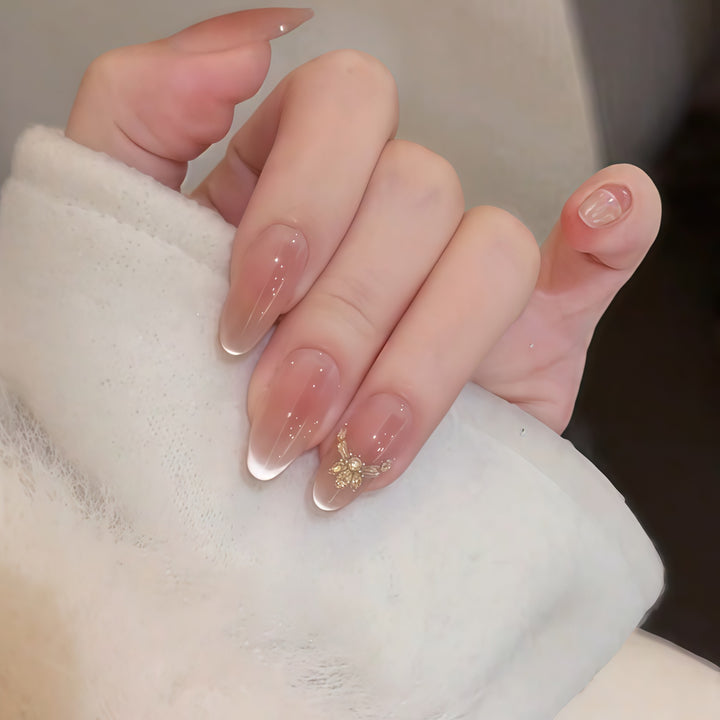Artificial nails with elegant tip design and gold accents Bowlift
