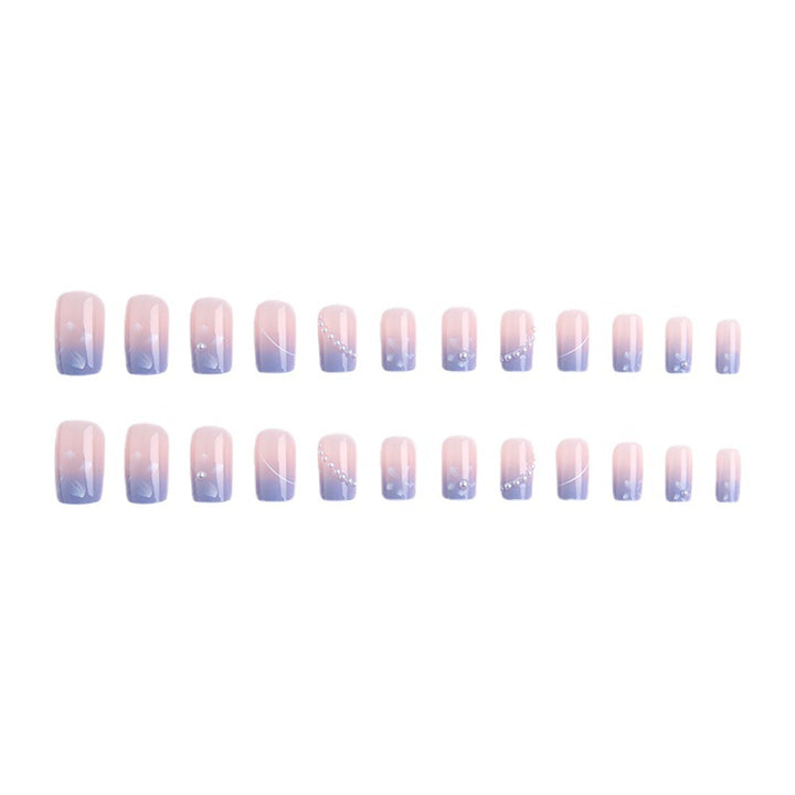 Nail set with elegant floral accents and glitter embellishments Bowlift