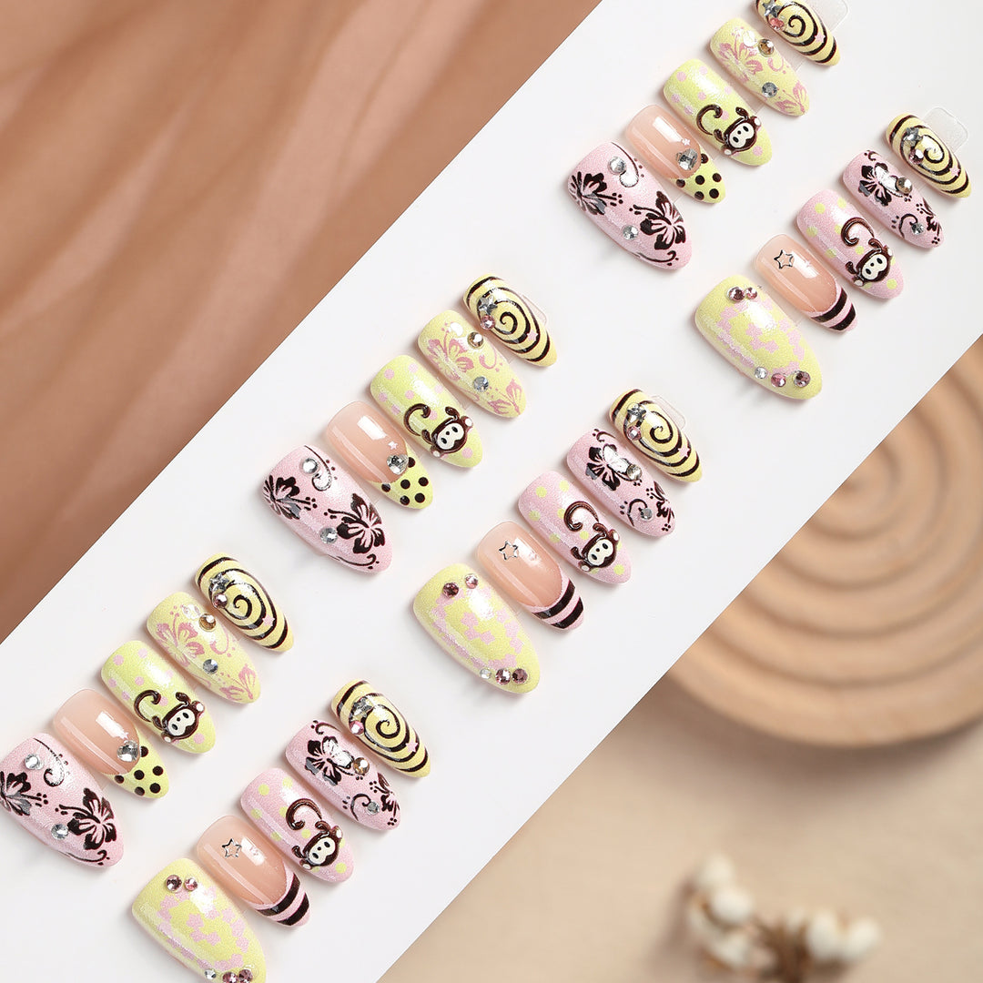 Creative nail art set with playful monkey designs and glitter details Bowlift
