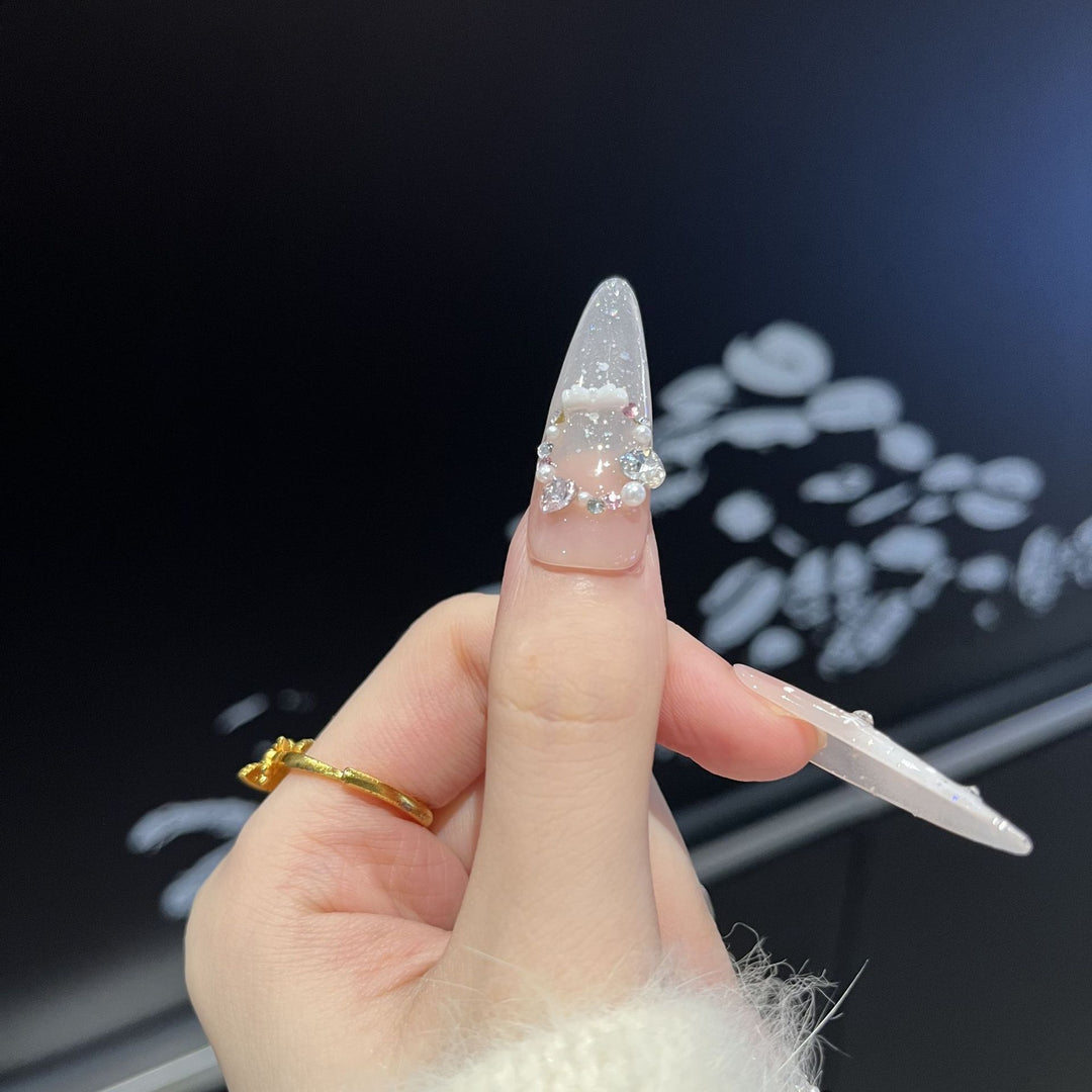 Artistic Press-On Nail Set with Snowflake and Gemstone Designs Bowlift