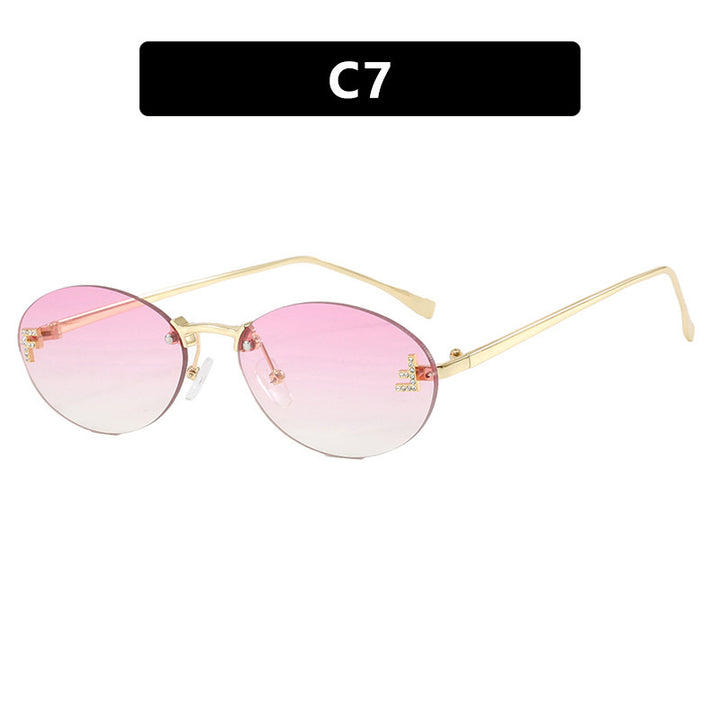Women's fashionable sunglasses with elegant, round lenses and delicate metal frame Bowlift