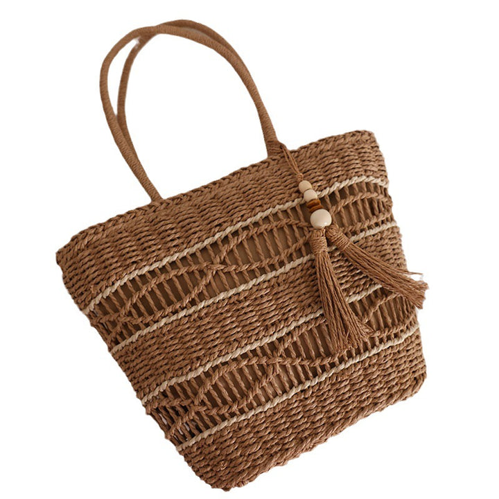 Handcrafted straw tote bag with decorative tassel detail Bowlift
