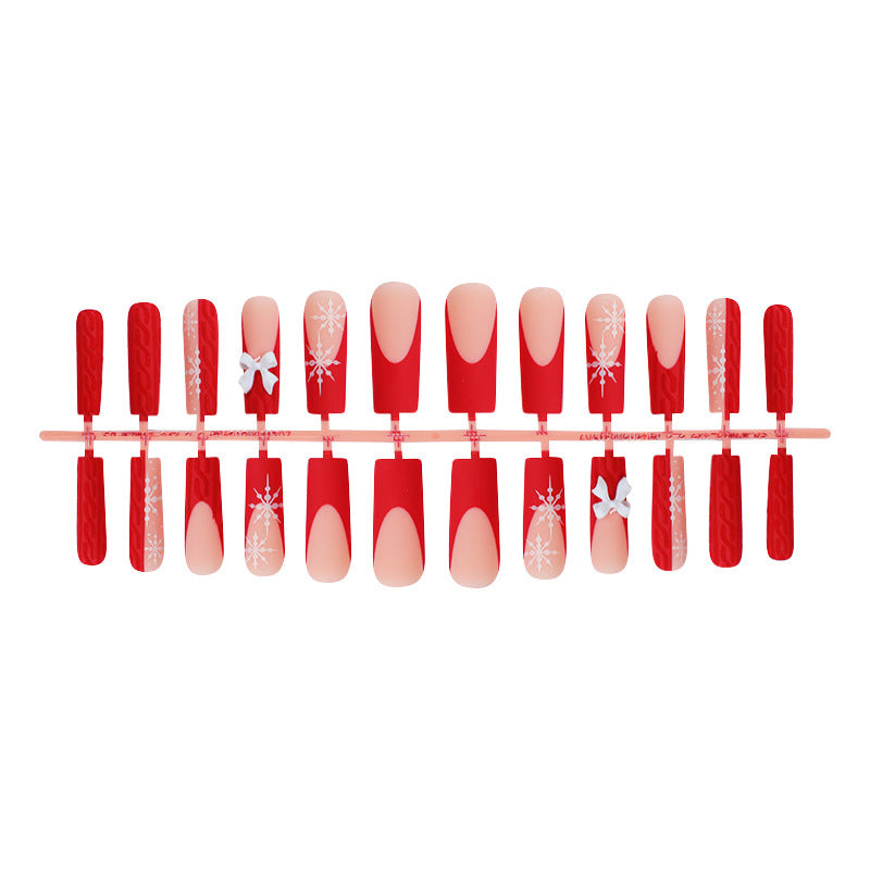Artificial nail set with festive snowflake and bow motifs Bowlift