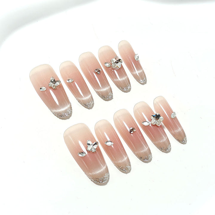 Glamorous artificial nails with glitter decorations Bowlift