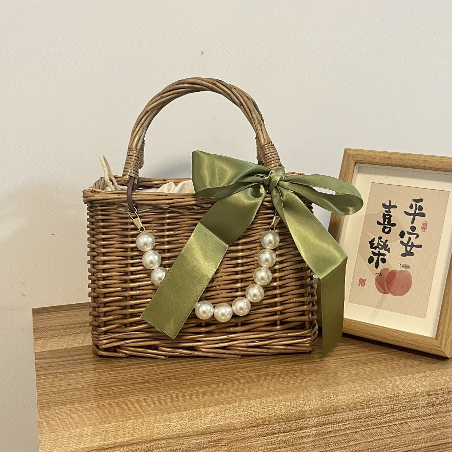 Ladies' basket bag with decorative pearl accents and bow decoration Bowlift