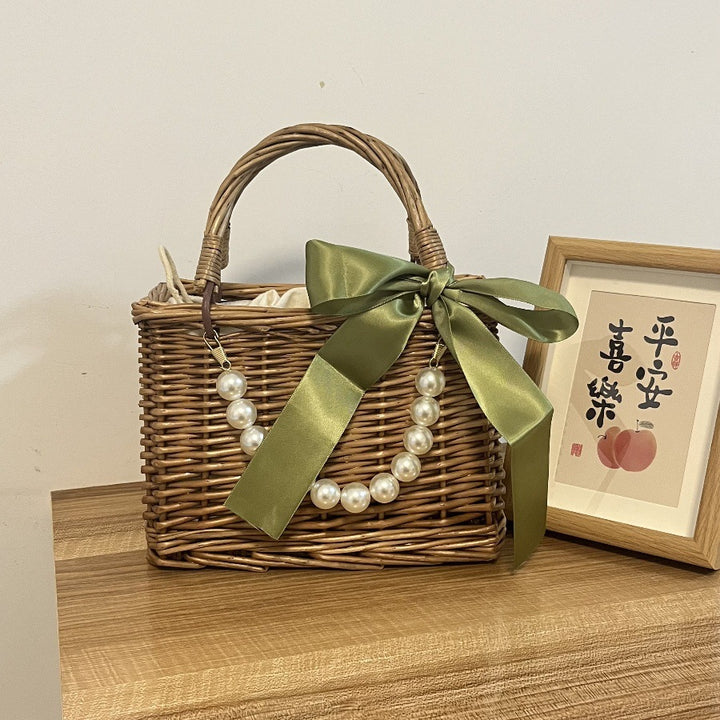 Ladies' basket bag with decorative pearl accents and bow decoration Bowlift