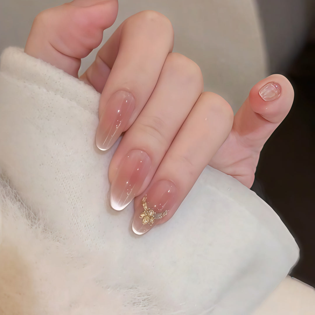 Artificial nails with elegant tip design and gold accents Bowlift