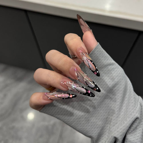 Artifical nail tips with elegant designs and glitter accents Bowlift