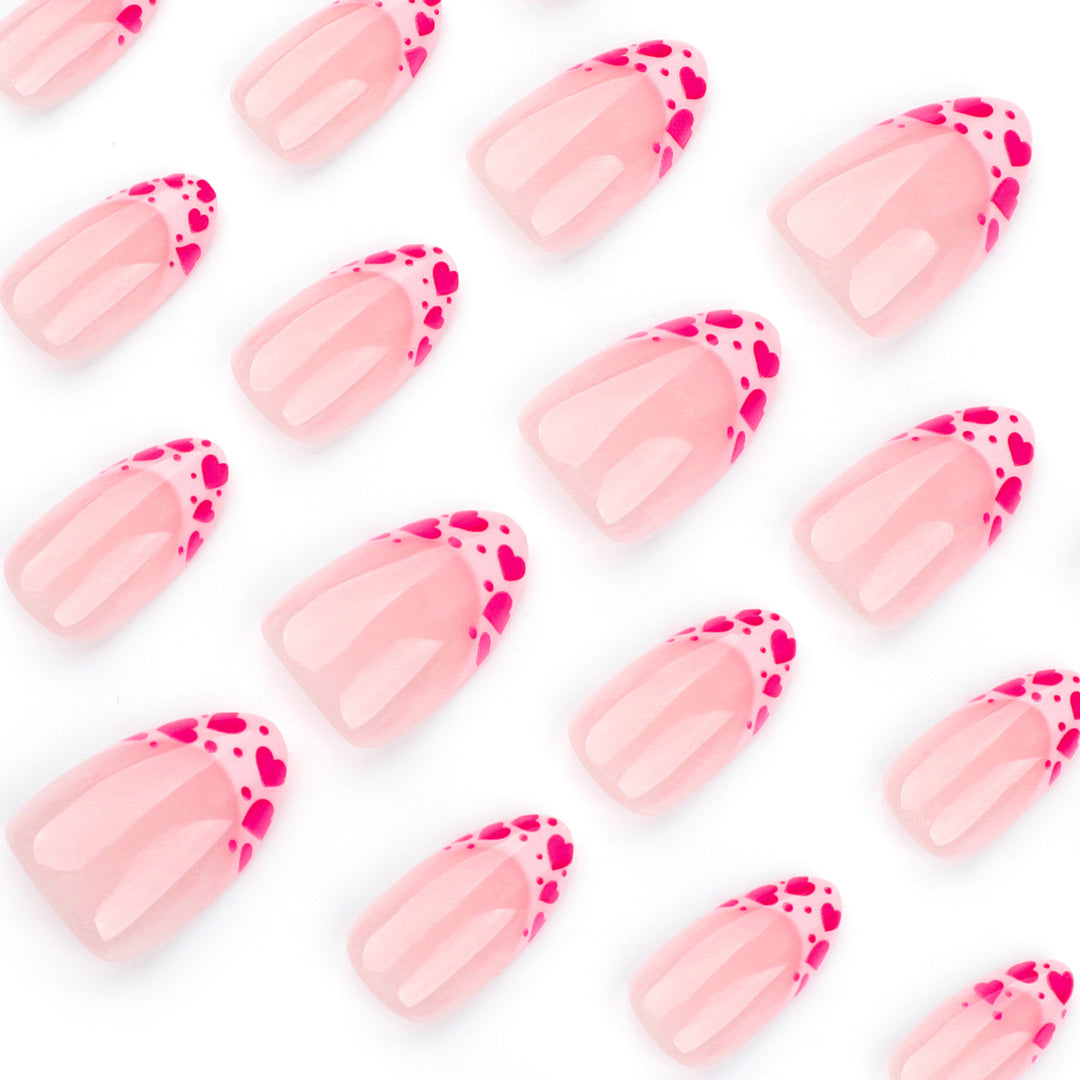 Artificial nail extensions with heart tip accents Bowlift