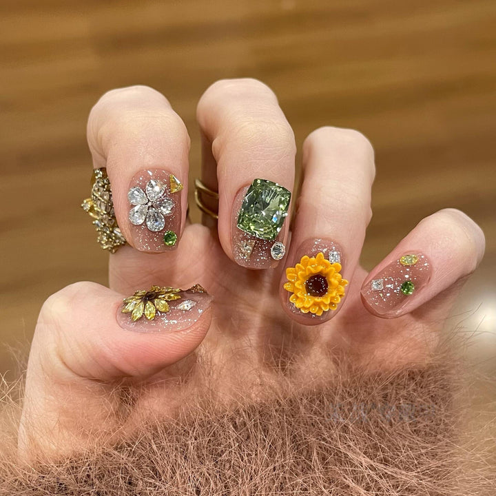 Artificial nails with sparkling appliqués and floral designs Bowlift