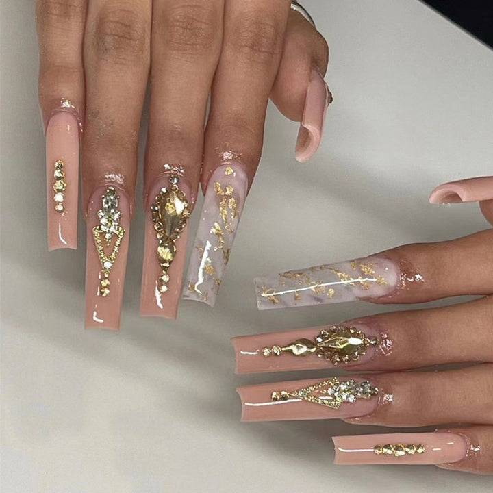 Artful nail extensions with glitter embellishments and delicate accents Bowlift