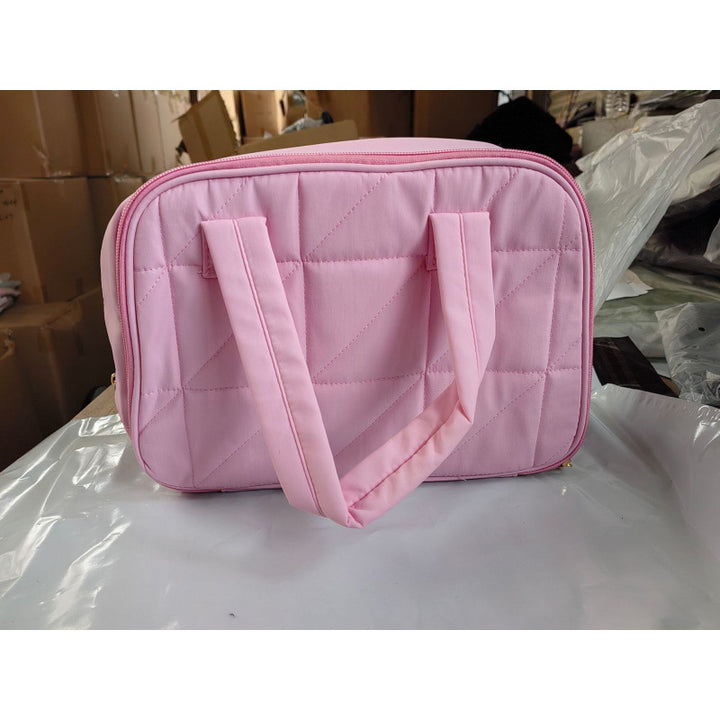 Cosmetic bag with padded interior compartment Bowlift
