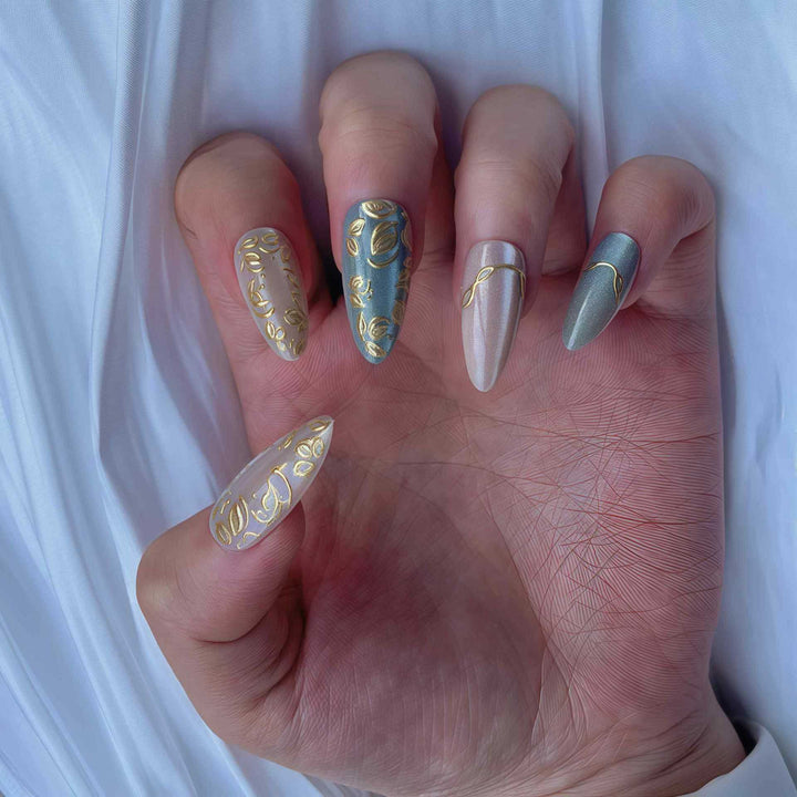 Artistic Stiletto Press-On Nail Set with Elegant Gold Accents Bowlift