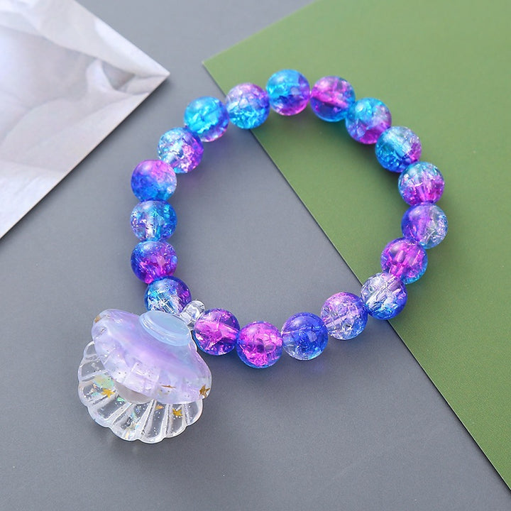 Playful bracelet with shell pendant Bowlift